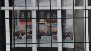 Group historic photo behind bars